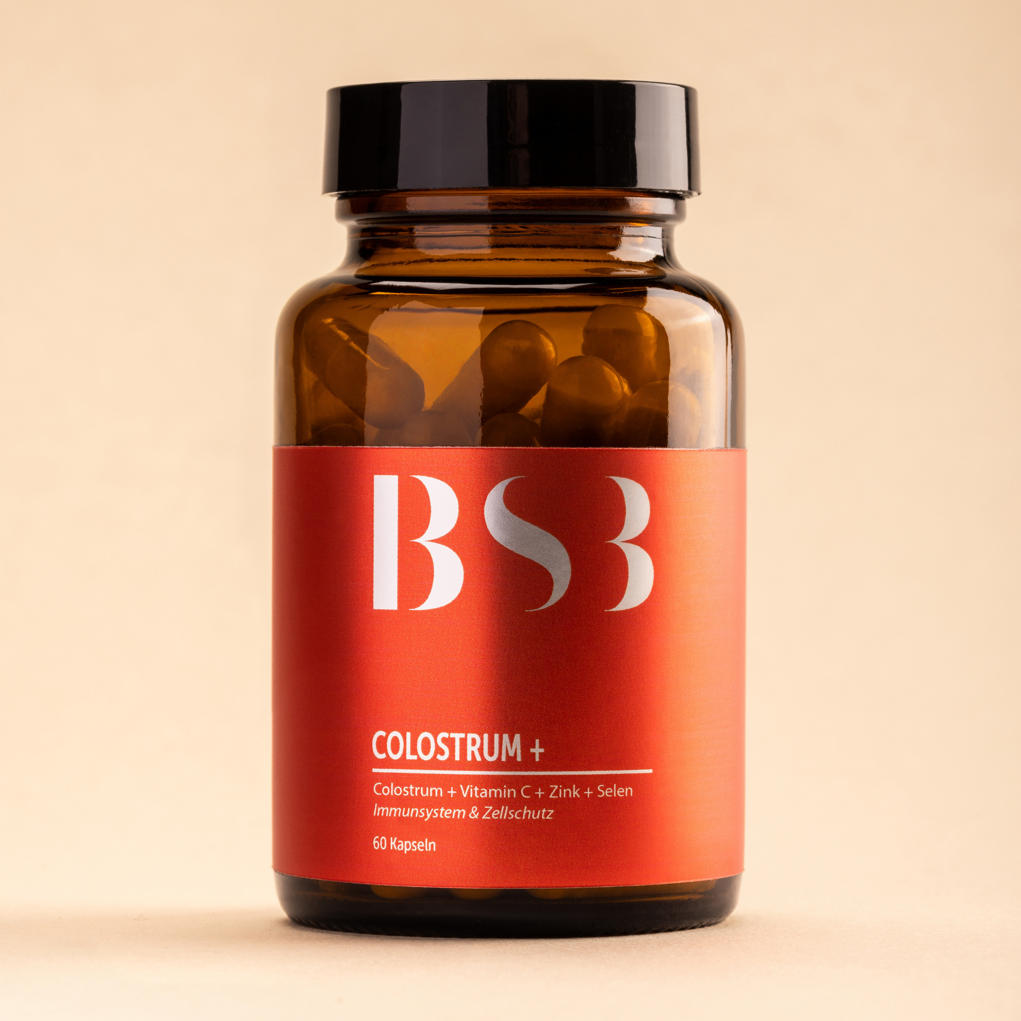 Hautpflegeprodukt Colostrum + von BeautySystem-3, cremige Textur und natürliche Inhaltsstoffe in einer schwarzen Verpackung