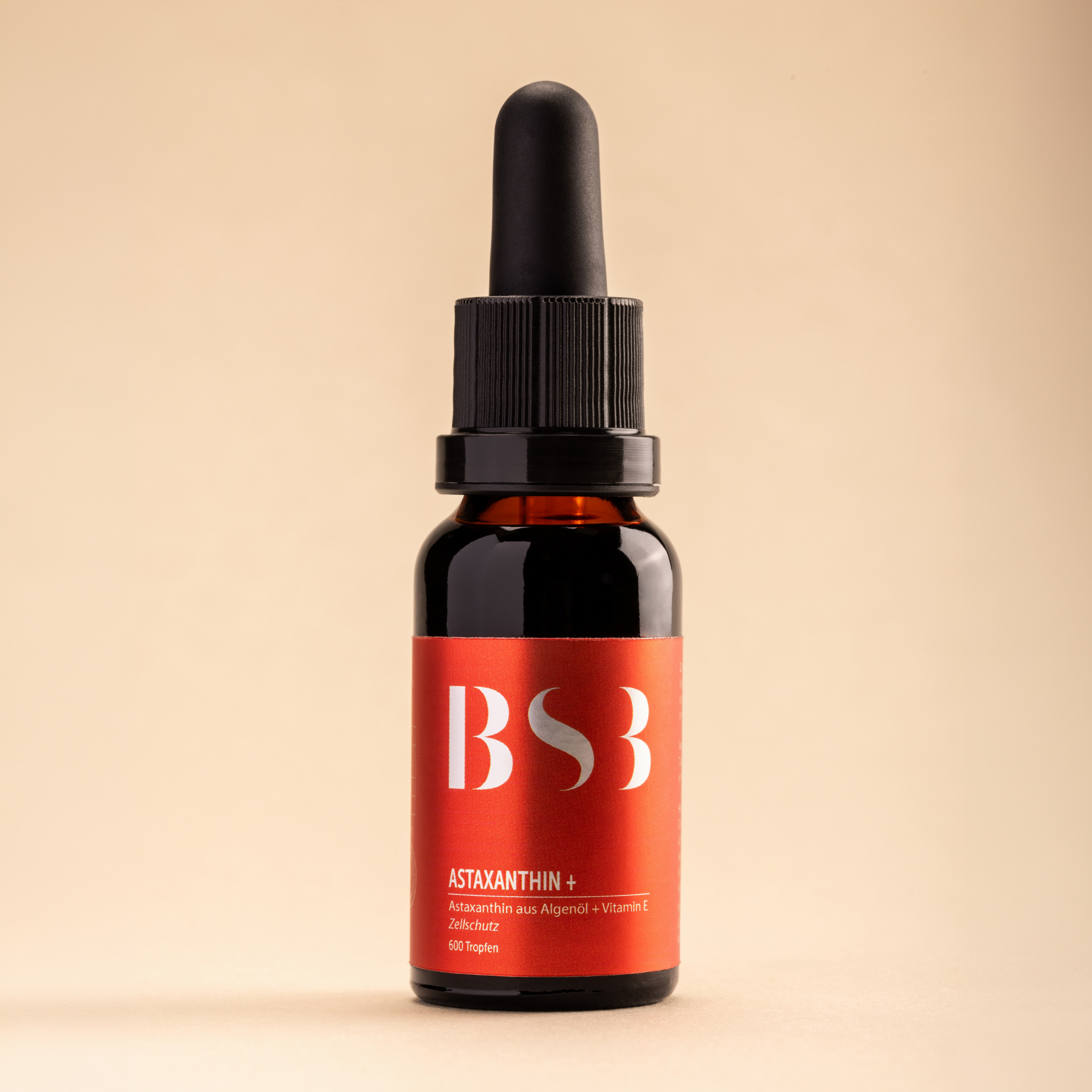 Schönheits-System-3 Astaxanthin Plus Kapseln mit orangefarbenen Kapseln und grüner Verpackung im Hintergrund